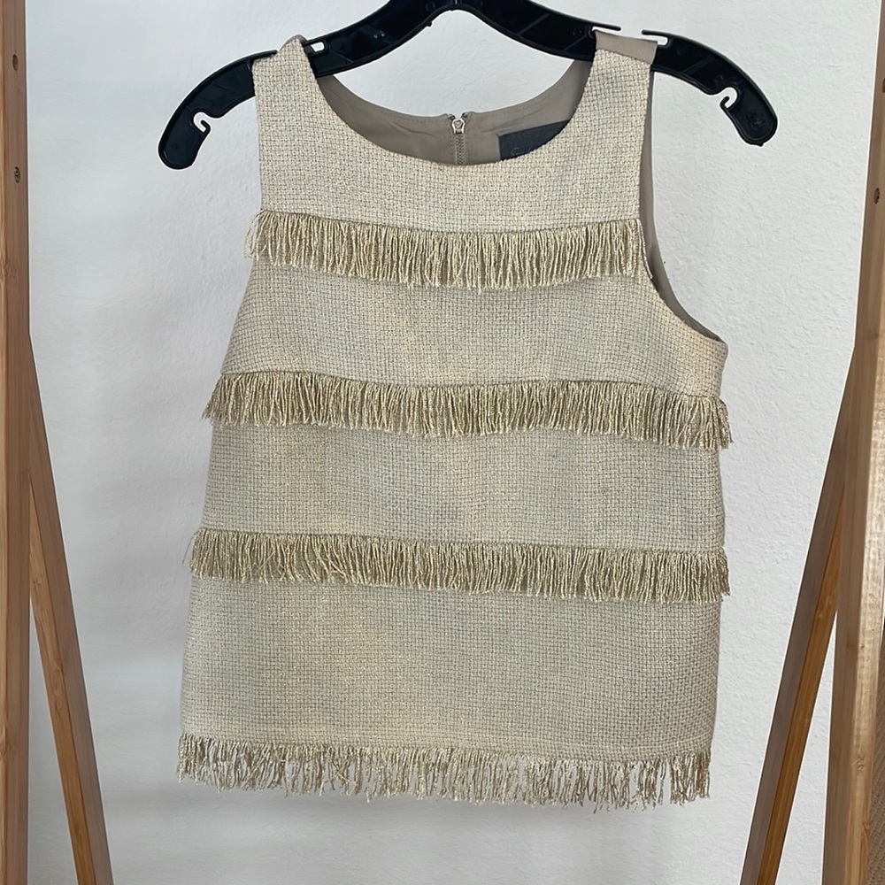 Anthropologie. Size S. Gold metallic thread woven with fringe tiers on front